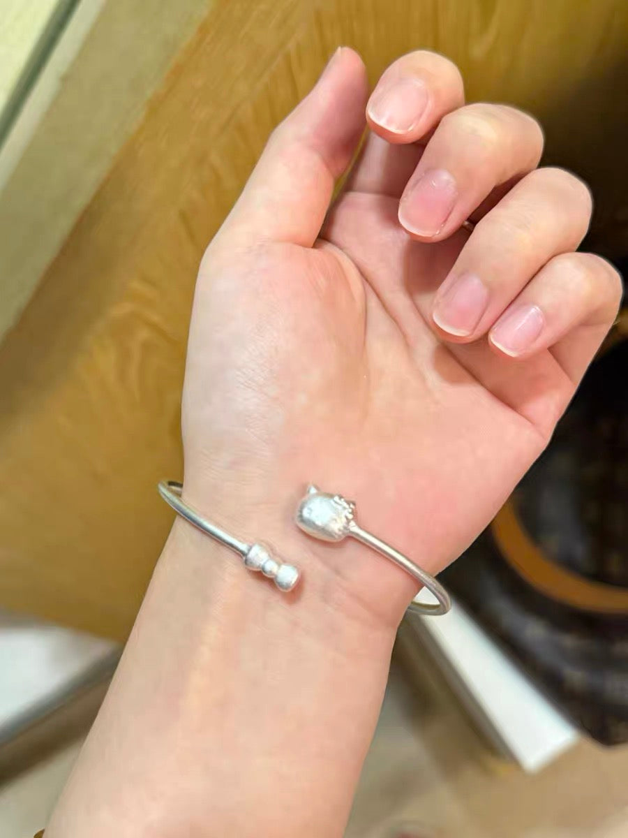 Twirl bow silver bracelet