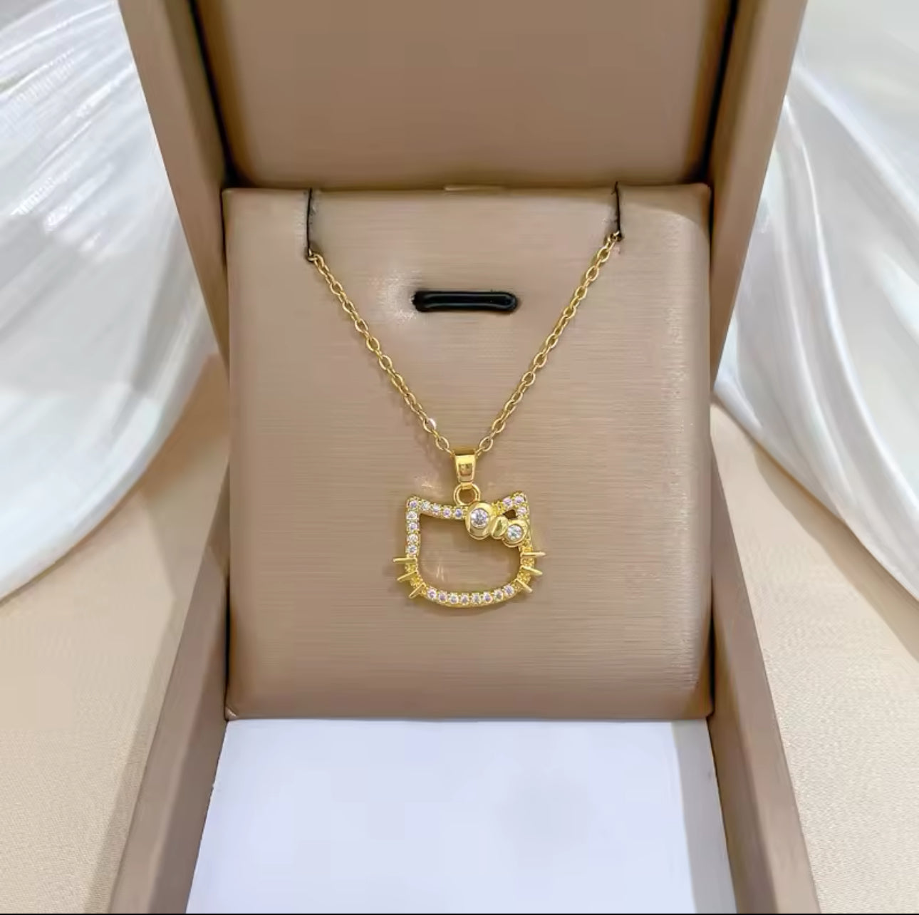 Gold HK necklace.